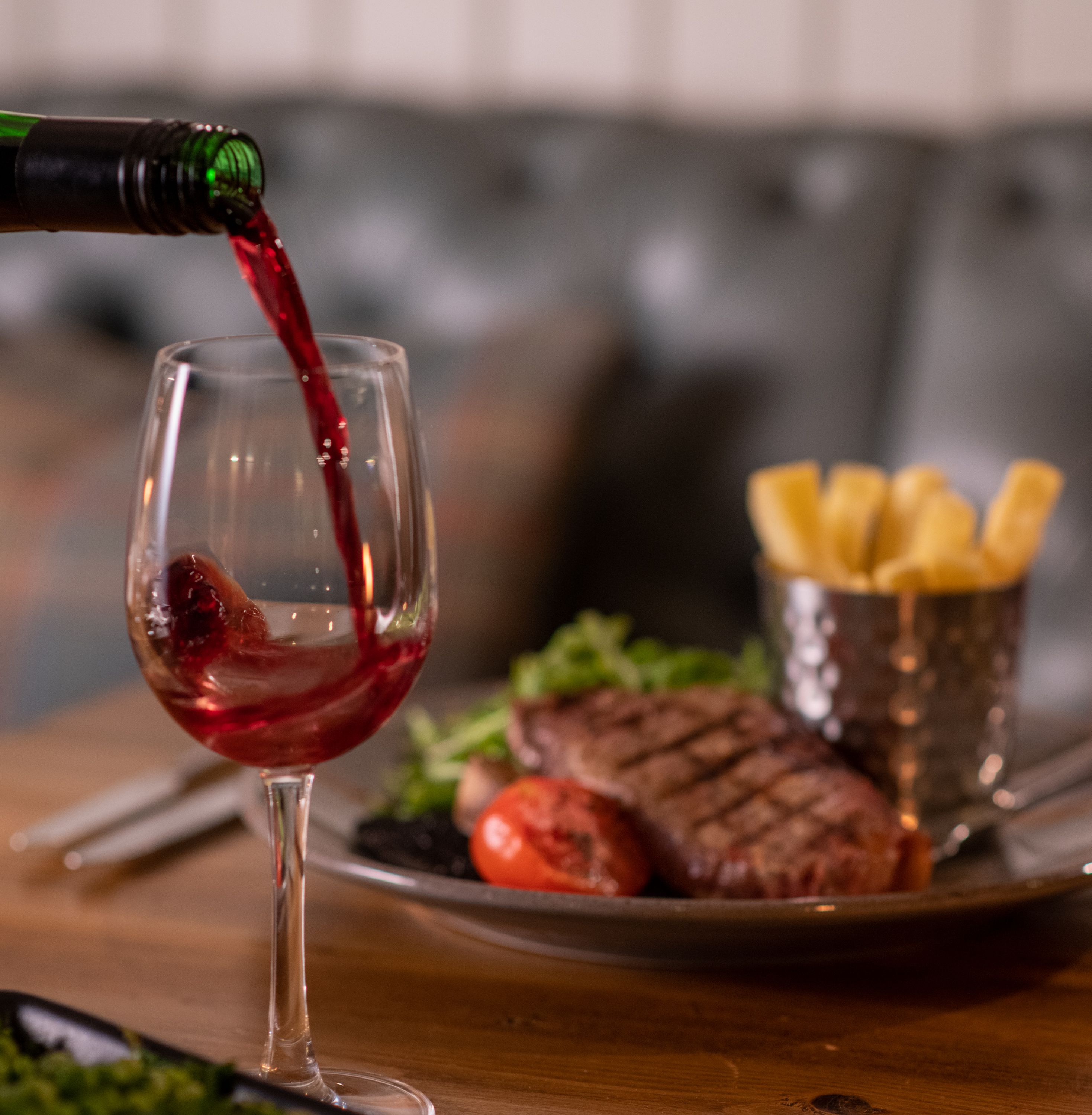 steak and chips with wine