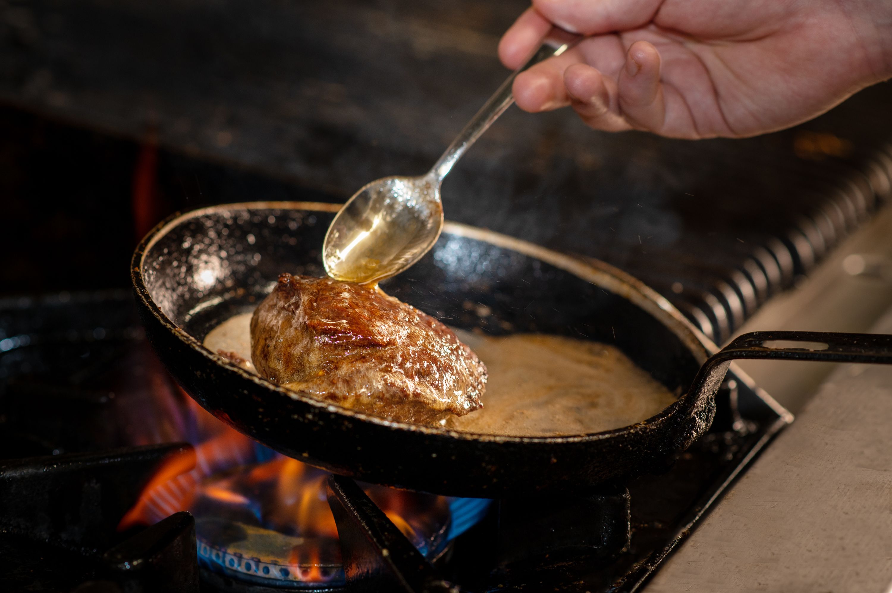 steak being cooked on stove